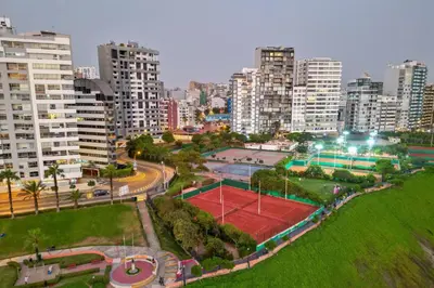 an aerial view of a tennis court in a city at Modern Duplex by the sea Miraflores in Lima