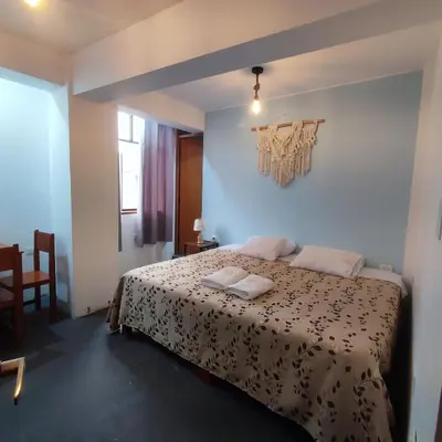 a bedroom with a bed in a room at Hospedaje Velilu in Ica
