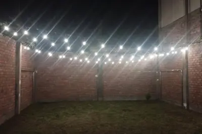 a room with a bunch of lights on a brick wall at Casa Elizabeth in Huancayo