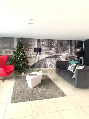 a living room with a christmas tree and a couch at Vista Brasil Dúplex in Lima