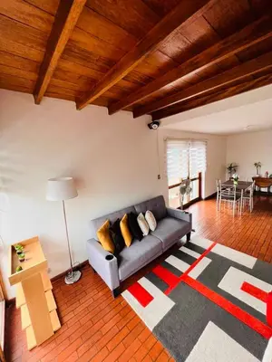 a living room with a couch and a table at MONTERRICO POLO APARTS #4 - Dpto Completo Familiar 2 camas a una cuadra Embajada USA in Lima