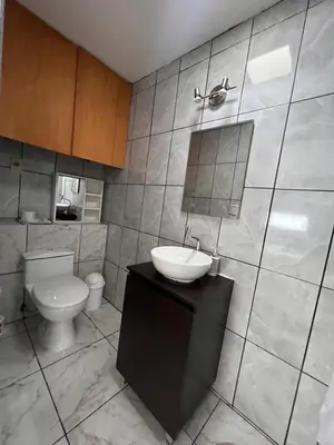 a bathroom with a sink and a toilet in it at MONTERRICO POLO APARTS #4 - Dpto Completo Familiar 2 camas a una cuadra Embajada USA in Lima