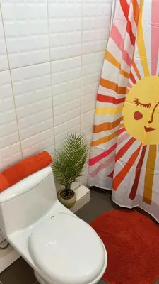 a bathroom with a toilet and a potted plant at loft apartament residencial ICA in Ica