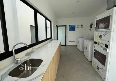 a kitchen with a sink and a counter top at Suite Romántica Vista al Mar Cerca al Aeropuerto y Miraflores in Lima
