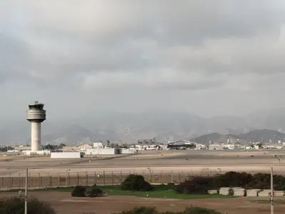 an airport with a control tower in the distance at Wasi de Sophia in Lima
