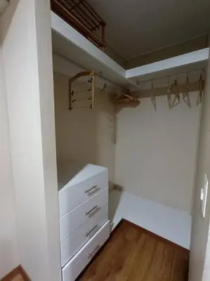 a room with a closet with a dresser and a shelf at Departmento Campo de Marte in Lima