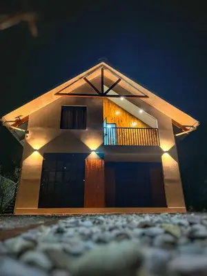 a model of a house lit up at night at La Casa de Anni Departamento 3 in Oxapampa