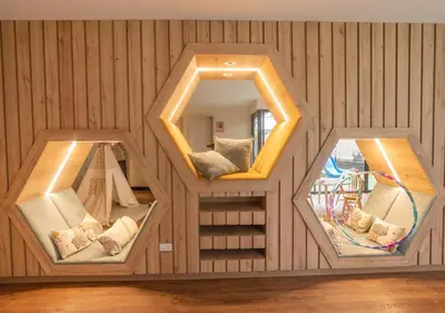 a small room with two mirrors in a wooden wall at Estreno en barranco BR1 in Lima