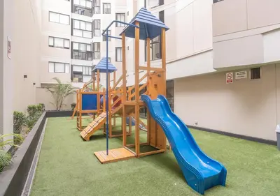 a playground in a building with a slide at Estreno en barranco BR1 in Lima