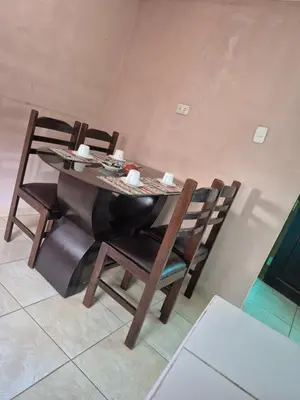 a dining room table and chairs in a room at Casa Mirador San Blas II in Cusco