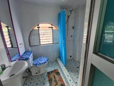 a bathroom with a sink and a toilet and a mirror at Casa Mirador San Blas II in Cusco