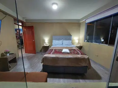 a bedroom with a large bed in a room at Casa Victoria - Huayllabamba, Urubamba Cusco, Perú in Huayllabamba
