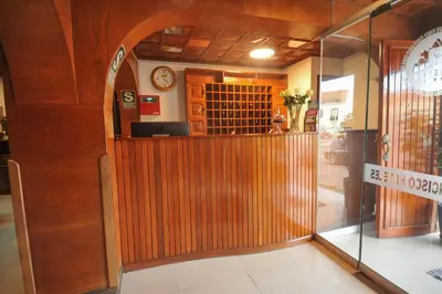 an entrance to a restaurant with a glass door at San Francisco Pardo Hotel in Cusco