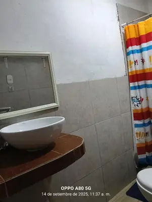 a bathroom with a sink and a shower at Casita de camucha in Chincha Baja