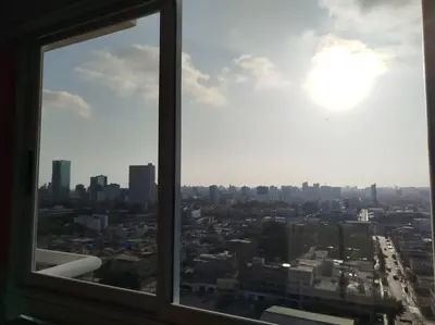 a view of a city from a window at Habitación con baño compartido Santa Catalina in Lima