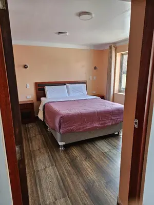 a bedroom with a large bed in a room at Casa Rustica Hostal Paqcha in Cusco