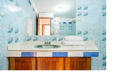 a bathroom with a sink and a mirror at San Borja Pentagonito in Lima