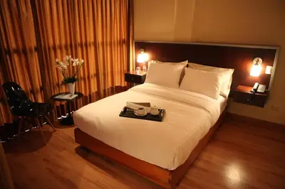 a hotel room with a large bed with a tray on it at Park Hotel Lima in Lima