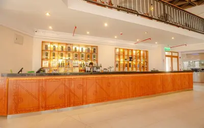 a bar with a wooden counter in a building at Hotel Andesmar Huancayo in Huancayo