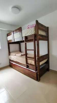 a room with two bunk beds in a room at Departamento en playa Arica in Lurín