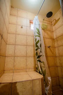 a shower with a shower curtain in a bathroom at Spacious entire house with awesome mountain views in Urubamba
