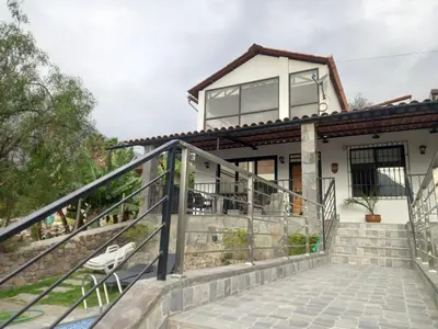a house with a staircase leading up to it at CASA DE CAMPO CON PISCINA EN COCACHACRA HUAROCHIRI SOL TODO EL AÑo in Cocachacra