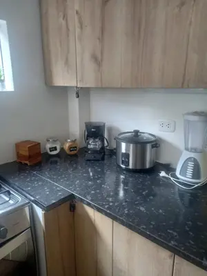 a kitchen with a counter top with a slow cooker at CASA DE CAMPO CON PISCINA EN COCACHACRA HUAROCHIRI SOL TODO EL AÑo in Cocachacra