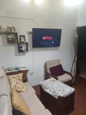 a living room with a couch and a chair at bungalows in Santa Rosa