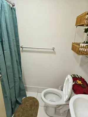 a bathroom with a toilet and a sink at El Refugio de Katte VI in Lima