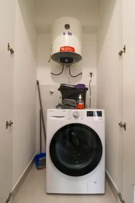 a washer and dryer in a room at Qoyllur by Wynwood House in Cusco