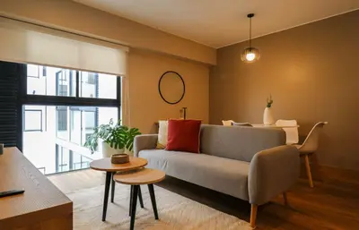 a living room with a couch and a table at Vital by Wynwood House in Lima