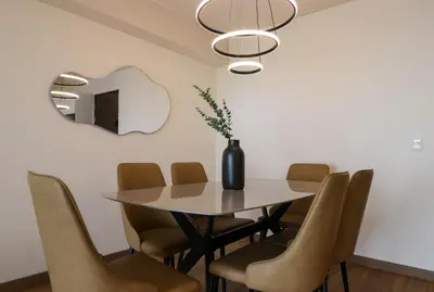 a dining room with a table and chairs at Aquilaria by Wynwood House in Lima