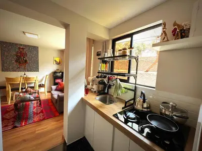 a kitchen with a sink and a counter top at boutique guest house art in the center of cusco in Cusco
