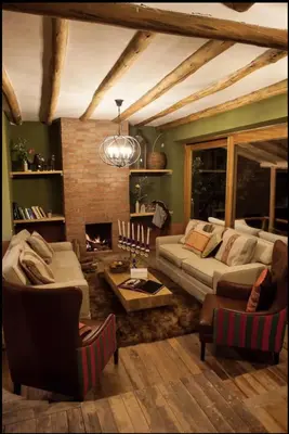 a living room with a couch and a fireplace at SAMAY WASI Rest house in Ollantaytambo