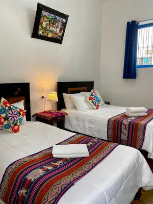 a room with two beds at Amira's House Cusco in Cusco
