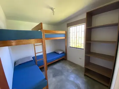 a room with two bunk beds and a window at Casa de campo con impresionante vista a las montañas y cascada en Canta in Canta