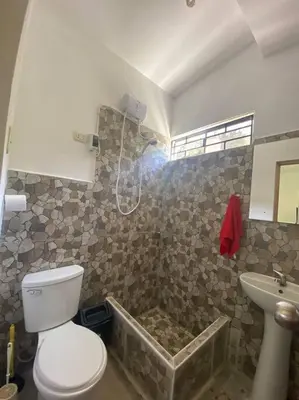 a bathroom with a toilet and a bath tub at Casa de campo con impresionante vista a las montañas y cascada en Canta in Canta