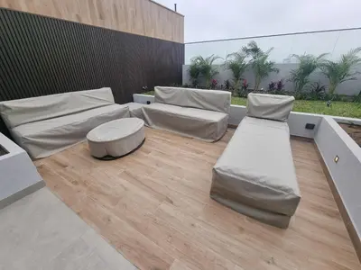 a room with two beds and a table at Apartamento en Miraflores in Lima