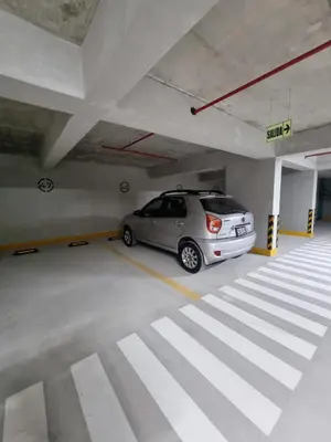 a car is parked in a parking garage at Apartamento en Miraflores in Lima