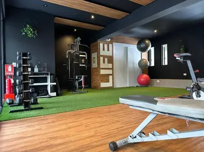 a fitness room with a gym with a treadmill at Deluxe Apartment in San Isidro in Lima