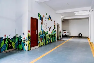 a garage with a painting on the wall at Willka Wasi Cusco in Cusco