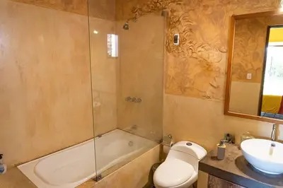 a bathroom with a shower and a sink and a toilet at Casa Cusco in Cieneguilla