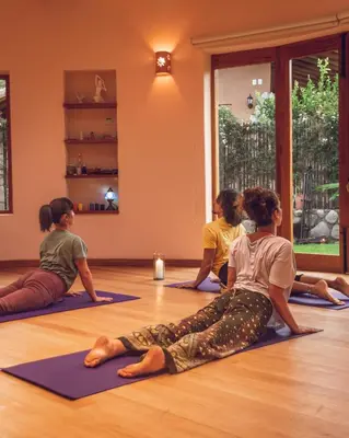 a group of women sitting in a yoga class at Casa Tikawarmi in Urubamba
