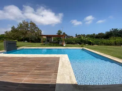 a swimming pool in a yard with a gazebo at Casa de campo en Hacienda San Andres in San Andrés