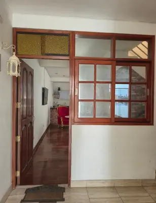 an entrance to a room with a door and windows at Excelente Departamento las viñas in La Molina