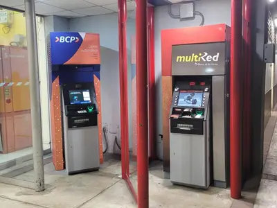 three atm machines are lined up in a store at Centrico departamento en Lima in Lima