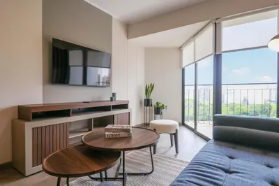 a living room with a couch and a table at Benavides by Wynwood House in Lima