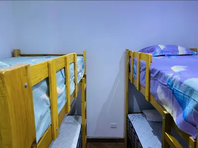 two bunk beds sitting next to each other in a room at Apartamentos como en casa in Chancay