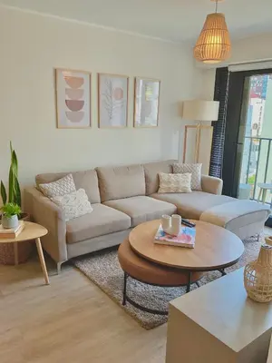 a living room with a couch and a table at Lima Limón in Lima
