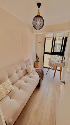 a living room with a couch and a piano at Lima Limón in Lima